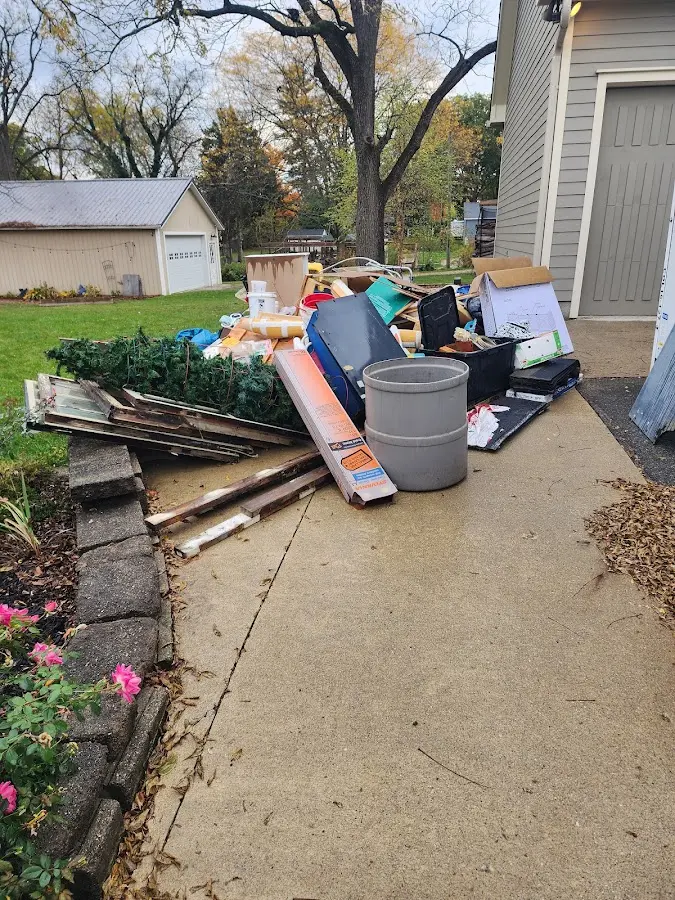 Dumpster being loaded with debris for 30 Yard Dumpster Rental in Carlisle